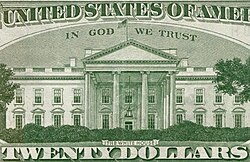 In God We Trust en mayúsculas en el reverso de un billete de veinte dólares estadounidenses.