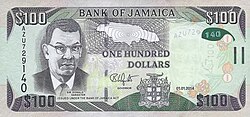 Billete de cien dólares jamaicanos perteneciente al cono monetario del país