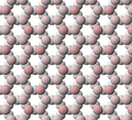 Representación de la estructura laminar tetraédrica del talco con los iones de oxígeno apicales resaltados.
