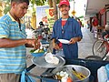 Vendedor ambulante de arroz de lisa