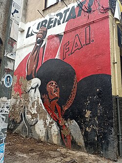 Grafiti urbano que reproduce un cartel histórico de la FAI