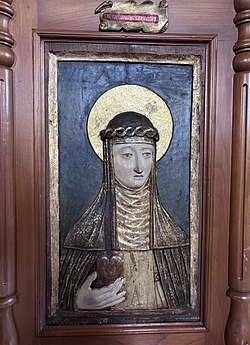 Pintura histórica de Santa Catalina de Siena en el refectorio de un convento dominico.