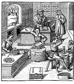Grabado medieval que representa el trabajo en una ceca o casa de moneda.