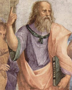 Platón señalando al cielo en La escuela de Atenas