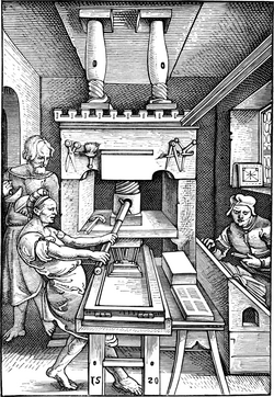 Representación histórica de una imprenta de madera del siglo XVI.