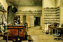 Michael Faraday, físico y químico del siglo XIX, en su laboratorio.
