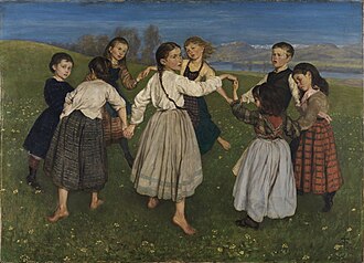 Niños bailando en un campo