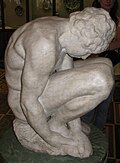 Joven en cuclillas de Miguel Ángel