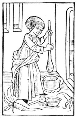Mujer elaborando mantequilla de forma artesanal.