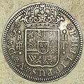 Reverso de una moneda de 2 reales de Felipe V acuñada en Segovia.
