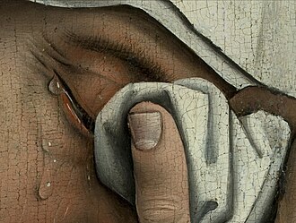 Detalle de las lágrimas y la expresión de dolor en una de las figuras laterales